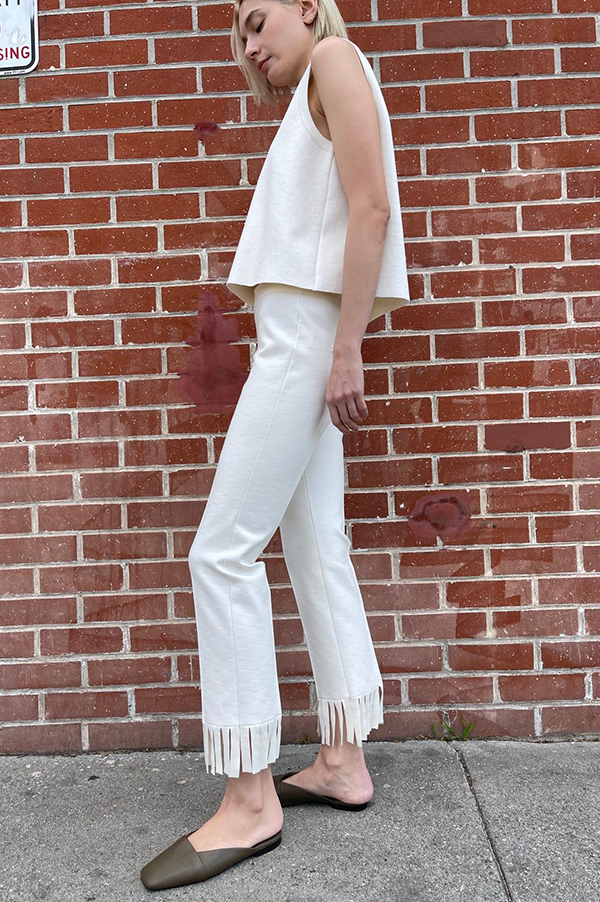 High Sport Fringed Louis Pant. High Sport Ecru Pant. High Sport Light Cream. High Sport Soft knit in Italian cotton. High Sport Knit in Italy. Cousin to the classic High Spot Kick Pant. High Sport Pull-on pant. High Sport Slender fit. High Sport Fringe detail at ankle. High Sport Subtle Jacquard Print. 
High Sport Versatile Excellent fit Day to Night Exceptional quality Timeless. Made in Italy. Designed in Los Angeles. High Sport Los Angeles. Des Kohan Boutique High Sport. High Sport West Hollywood. 