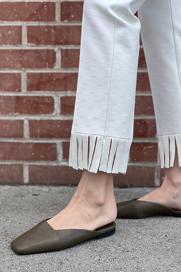 High Sport Fringed Louis Pant. High Sport Ecru Pant. High Sport Light Cream. High Sport Soft knit in Italian cotton. High Sport Knit in Italy. Cousin to the classic High Spot Kick Pant. High Sport Pull-on pant. High Sport Slender fit. High Sport Fringe detail at ankle. High Sport Subtle Jacquard Print. 
High Sport Versatile Excellent fit Day to Night Exceptional quality Timeless. Made in Italy. Designed in Los Angeles. High Sport Los Angeles. Des Kohan Boutique High Sport. High Sport West Hollywood. 