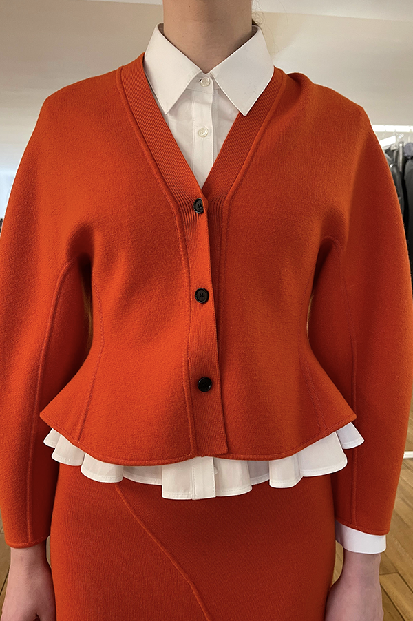 Ashlyn Henry Cardigan. Ashlyn cardigan with peplum. Ashlyn soft merino wool. Ashlyn knit. Ashlyn Fall 2025, Ashlyn sweater. orange hued. Luxurious knit. Persimmon cardogam. Tangerine cardigan. Des Kohan Ashlyn. Des Kohan Fairfax Ashlyn. Ashlyn West Hollwood. Ashlyn exclusives. 