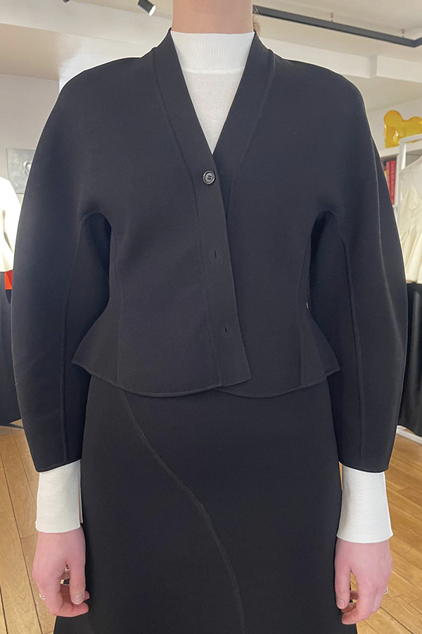 Ashlyn Henry Cardigan. Ashlyn cardigan with peplum. Ashlyn soft merino wool. Ashlyn knit. Ashlyn Fall 2025, Ashlyn sweater. Ashlyn black cardigan. Ashlyn black sweater. Ashlyn noir sweater. Luxurious knit. Black cardigan. Noir cardigan. Des Kohan Ashlyn. Des Kohan Fairfax Ashlyn. Ashlyn West Hollwood. Ashlyn exclusives. Ashlyn winter 2025.