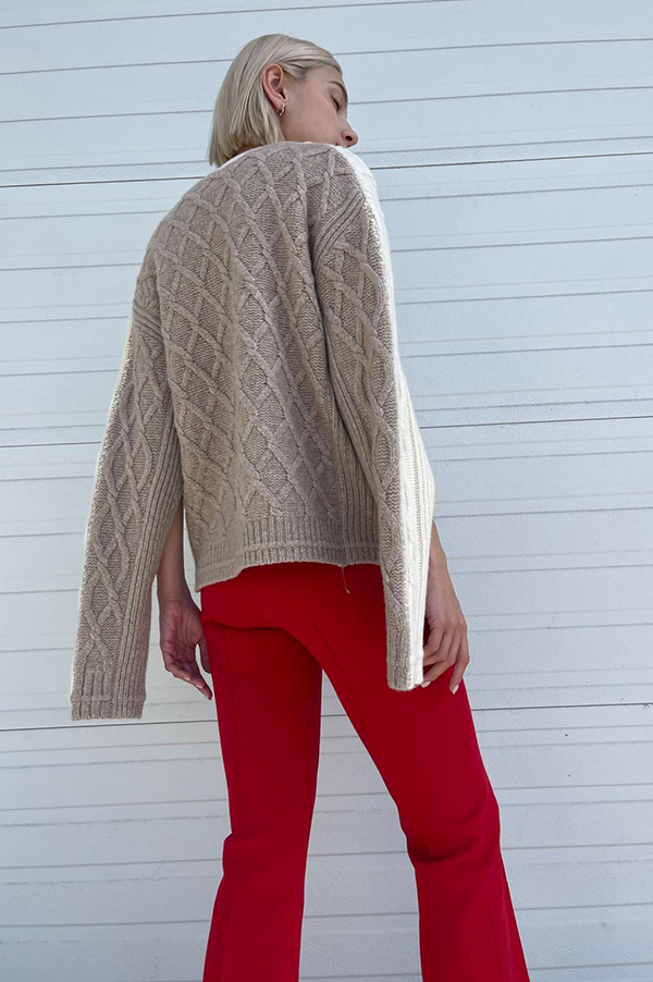Maria McManus Twisted Cable Cardigan Stone. Maria McManus Cardigan Cream. Maria McManus Twisted Cable Cardigan in Ivory. Maria McManus Ivory/Cream cardigan. Maria McManus fine merino wool Cardigan. Maria McManus Oversized Fit cardigan. Maria McManus Oversized Cream/Ivory sweater. Maria McManus sweater chunky stich cable. Ivory Chunky Cardigan. Cream Cable knit sweater. Maria McManus Cable knit sweater. Maria McManus two tone cardigan.Dark Horn button closure.Maria McManus cape arm cardigan.Ivory Taupe twist